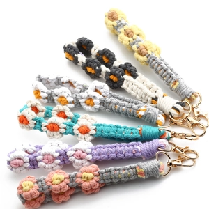 Handmade woven daisy lanyard set with colorful flower patterns and gold lobster clasps