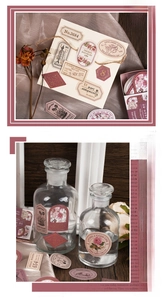 Detail of vintage gold-stamped stickers with floral and angel motifs for scrapbooking