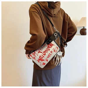 Rear view of a Halloween cleaver bag with bloody handprints and a bone hand pendant charm
