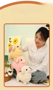 Detailed view of plush sheep dolls in pink, white, and yellow colors with curly horns