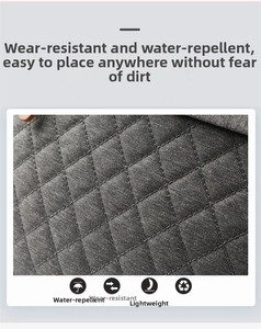 Close-up of water-resistant quilted grey fabric with durable and lightweight texture