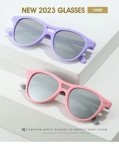 Close-up of lilac and pink double-bridge sunglasses with silver rivet details