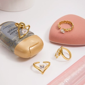 Detailed view of four piece set of 18K gold plated heart rings with zircon stones