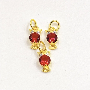 Exquisite gold-plated owl pendants with red zircon inlay and white crystal accents