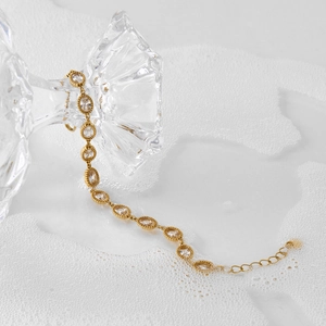 Elegant gold stainless steel bracelet with oval zircon stones and adjustable chain