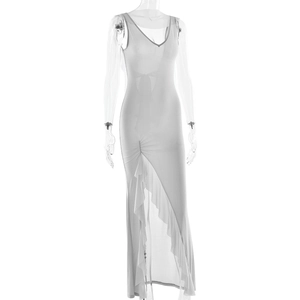 Detailed view of the V-neckline and ruffled high-slit hem of this white slim-fit maxi dress