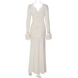 Detail of V-neck lace trim and ruffled cuffs on this slim fit beige maxi dress