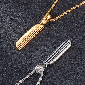 Close-up of hip hop style comb pendants in gold and silver finishes on twist chains