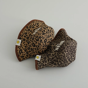 Close-up of leopard print cotton bucket hats with Boston embroidery in brown and beige