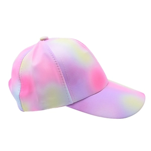 Close-up of vibrant tie-dye gradient patterns on the durable fabric of this kids baseball cap