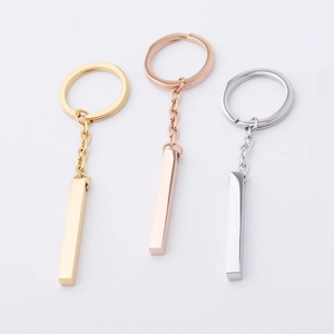 Polished rectangle bar keychains in gold, rose gold, and silver finishes on white background