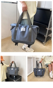 Three-view layout of grey travel bag with wheels, showing handle and expandable nylon fabric