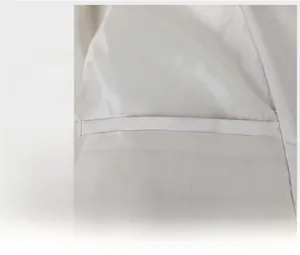 Detail view of the white casual jacket's inner lining with a secure hidden pocket