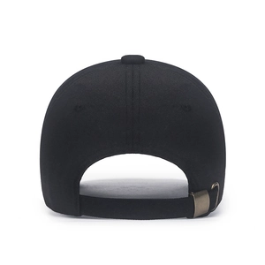 Minimalist black cotton baseball cap showing back view with adjustable bronze metal buckle