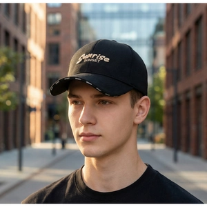 Detail of black baseball cap with Sunrise SUNSET embroidery and SPORT brim print