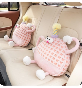 Detail of pink lamb wool monster car headrest with soft textured fabric and plush limbs