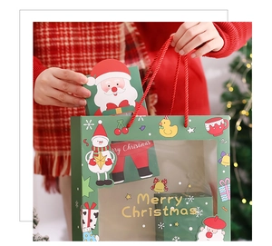Close-up of red and green Christmas paper gift box set with festive holiday illustrations