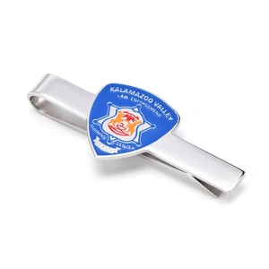 Detailed close-up of silver necktie clip featuring a blue enamel law enforcement shield