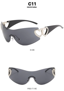 Front and side view of Y2K wrap around sunglasses with silver hollow heart decor