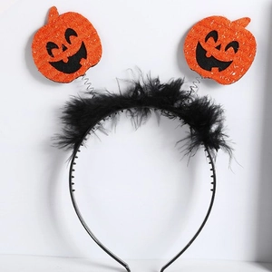 Halloween headband with orange pumpkin, black feathers and spring elements on a black base