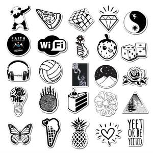 Flat lay of 25 black and white graffiti stickers with panda and astronaut designs