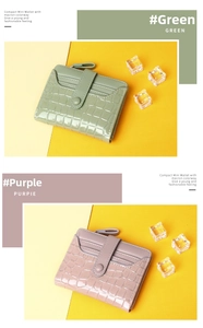 Detailed macro view of crocodile pattern patent leather mini wallets in green and purple colors