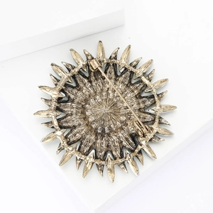 Detailed back view of vintage sunflower brooch with alloy texture and sturdy safety pin