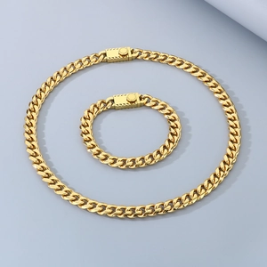 Detailed view of the 10mm golden Cuban link necklace and bracelet set with box clasps
