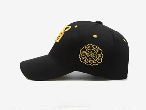 Detail view of cotton twill baseball cap with yellow B embroidery and circular badge logo