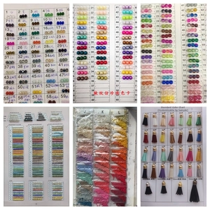 Macro display of diverse colorful glass seed beads, bugle beads, and fringe tassels