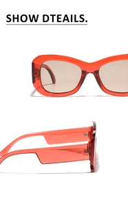 Detail of red translucent square sunglasses showing specifications and CE mark on temples