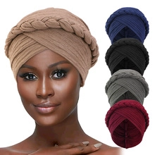 Detail view of multi-color twisted braid headscarf hats in soft elastic knit fabric