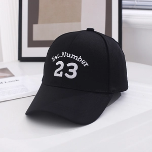 Close-up of Est.Number 23 white embroidery on a premium black cotton baseball cap