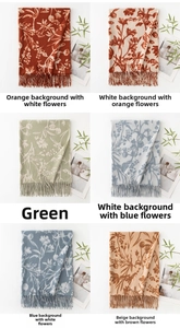 Close-up of floral cashmere feel scarves with delicate fringe edges in various colors