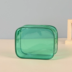 Portable green transparent PVC cosmetic bag with zipper for travel toiletries storage