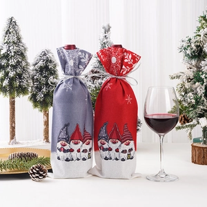 Festive Christmas wine bottle covers with gnome prints in red and grey fabric