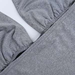 Macro shot of heather grey knitted tank top showing square neck texture and stitching