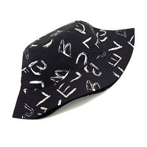 Detail of black bucket hat featuring white graffiti heart and letter digital printing