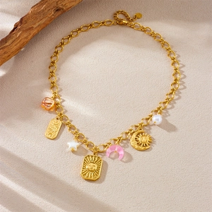Gold layered necklace featuring celestial sun and moon charms with colorful beads