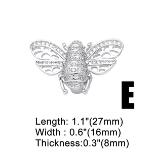 Macro detail of silver bee charm with cubic zirconia pavé and size dimensions