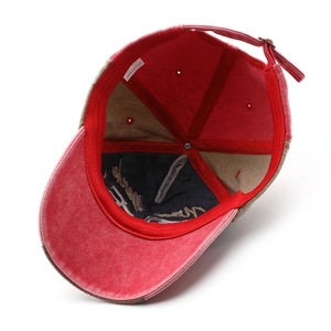 Inside view of washed cotton baseball cap showing stitching and adjustable strap