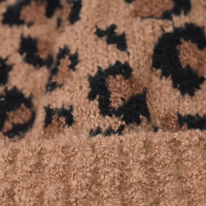 Close-up of leopard print faux shearling fabric showing soft texture and warm pattern