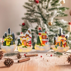 Set of 4 Christmas resin houses with warm LED lights featuring Santa and snowman figures