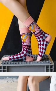 Detail of Lolita style crew socks featuring vintage argyle pattern and character illustration