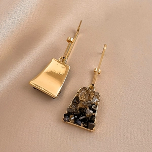Vintage geometric trapezoid earrings with crushed stones on champagne silk background
