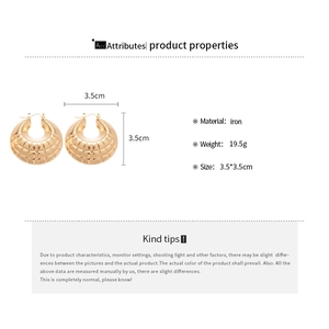 Detailed view of large gold quilted texture hoop earrings with size 3.5cm measurements