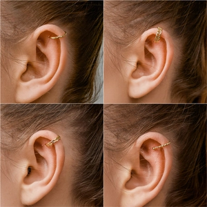 Detailed close-up showing four gold ear cuff textures on ear for non-pierced styling