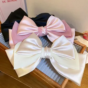 French style oversized satin bow hair clips in black, pink, and cream white colors