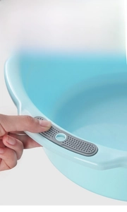 Detail shot of the anti-slip double handles and thick wall of this light blue plastic washbasin