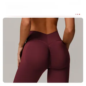 Close-up of high-waisted seamless burgundy yoga leggings with scrunch butt lift detail